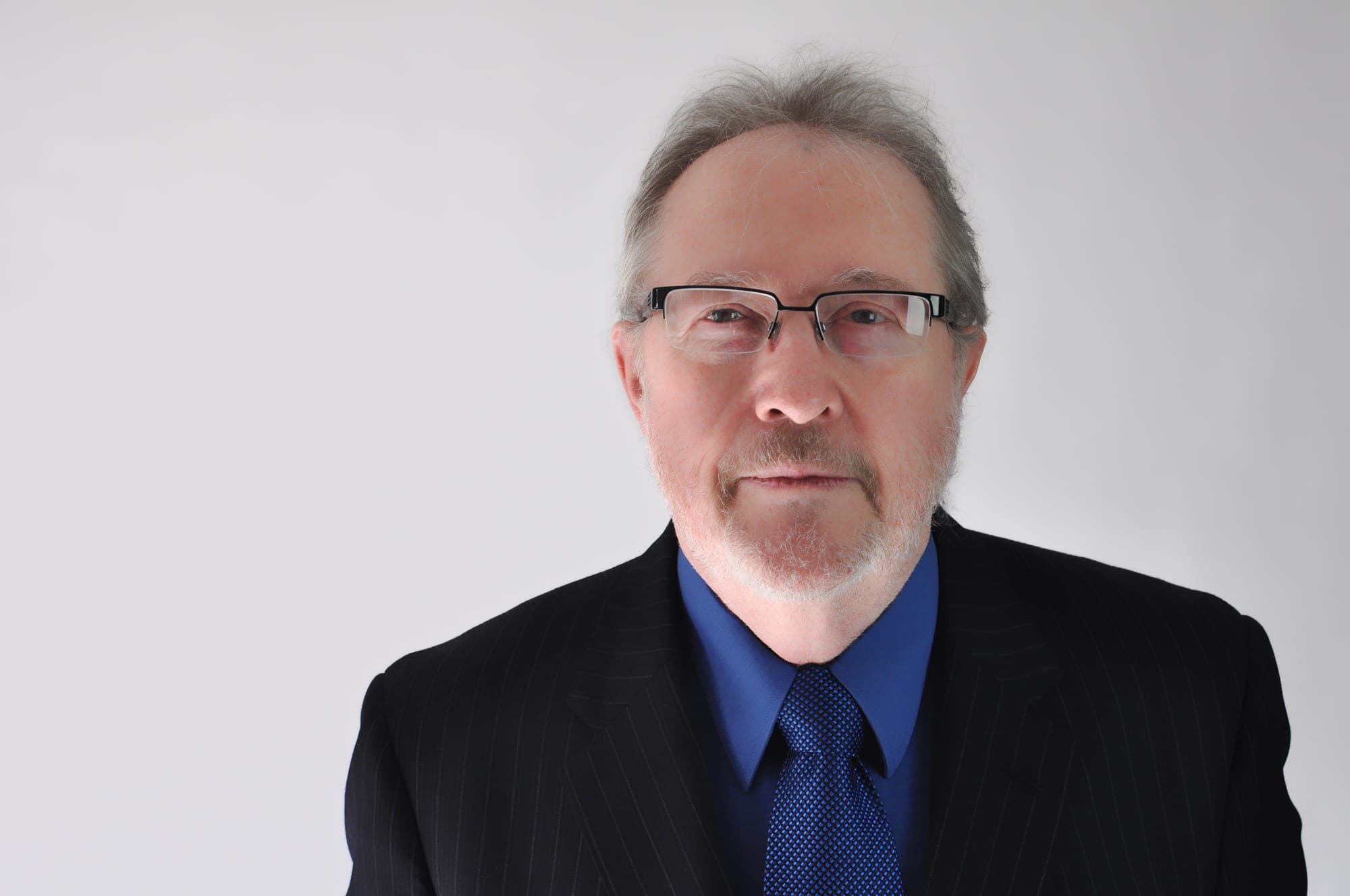 Corporate headshot of a man in a dark suit, Toronto studio